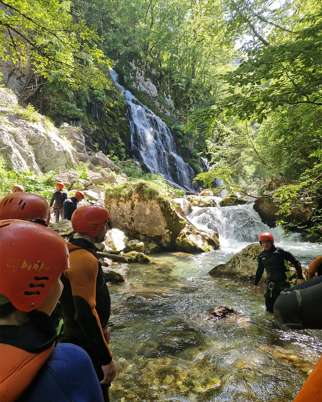 Guided Hrčavka canyoning tour beside a waterfall in Sutjeska National Park